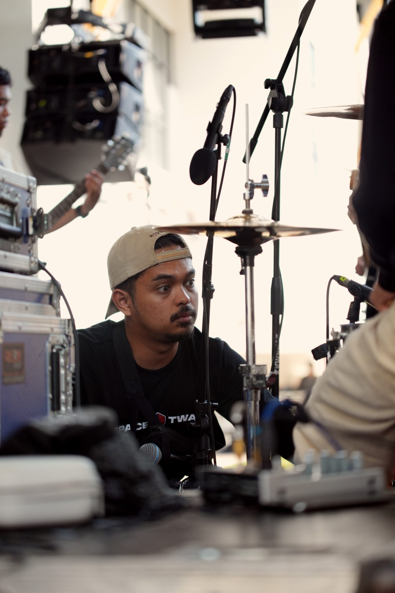 Afiq behind a drum kit
